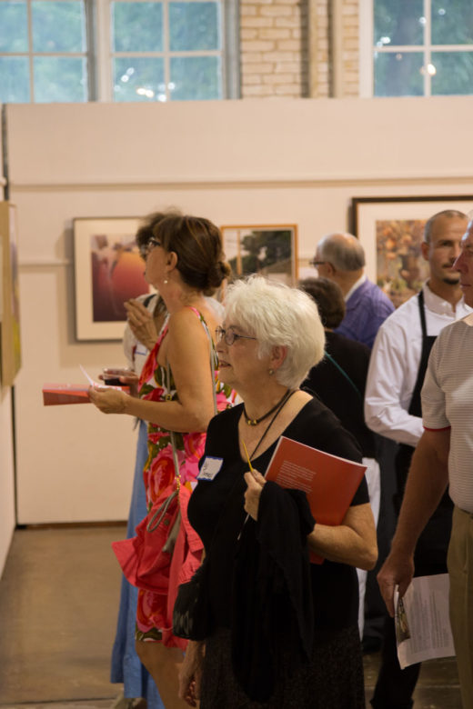 First Glance guests looking at fine art