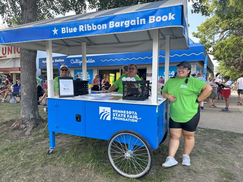 Foundation volunteers stationed at Blue Ribbon Bargain Book carts on the fairgrounds.